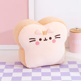 Side quarter view of the Bread Plush. The edges of the plush are a light brown color while the front and back of the plush is a light cream color to mimic the look of a slice of white bread.