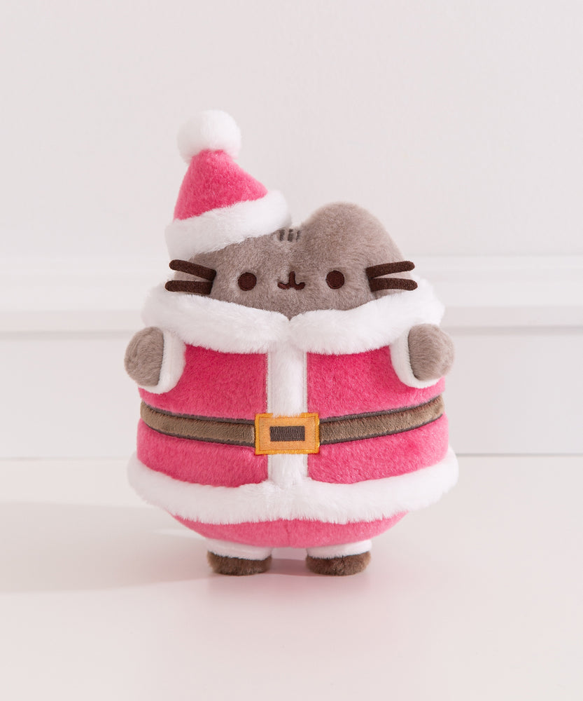 Front view of the Pusheen Santa Claus plush toy where a gray tabby cat wears a classic red and white santa costume with black accessories.
