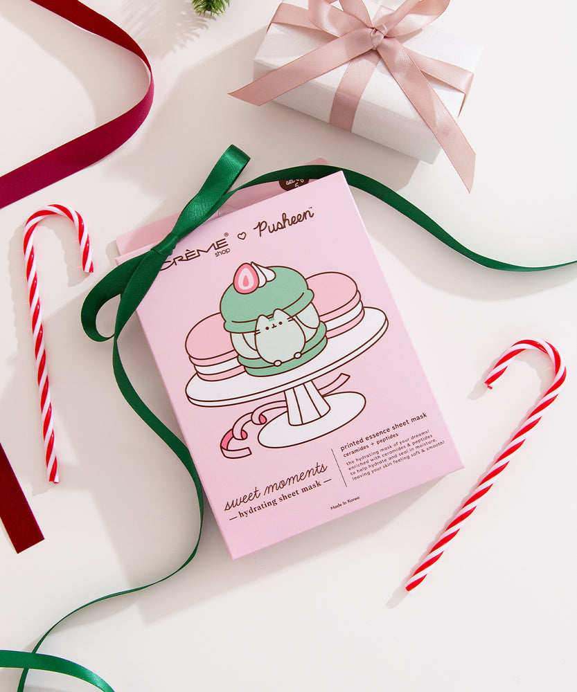 Sheet mask packaging box surrounded by festive decorations on a white background