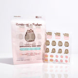Front view of Pusheen Blemish patches packaging and blemish sheet. The set includes 21 printed patches of Pusheen, Pusheen on top of a macaron, sprinkled donuts, and strawberries.