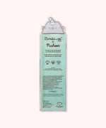Back view of the packaging of the Pusheen Holiday Lip Balm Duo. Printed on the back are directions for how to use the product as well as the ingredients in the product.