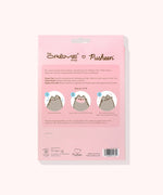 Back view of the Pusheen Sheet Mask 3-Pack Holiday Packaging. The ingredients and how to use the product is printed on the back and includes Pusheen graphics demonstrating how to use the product.