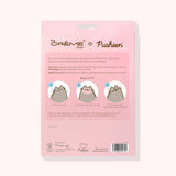 Back view of the Pusheen Sheet Mask 3-Pack Holiday Packaging. The ingredients and how to use the product is printed on the back and includes Pusheen graphics demonstrating how to use the product.