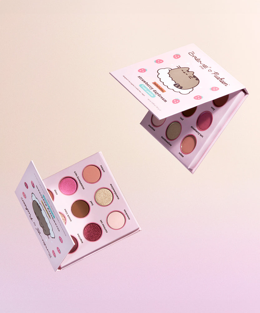 View of the interior and front of the Pusheen eyeshadow palette. There are 9 eyeshadows in the palette including matte shades and shimmers.