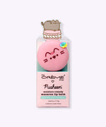 Macaron Lip Balm in its packaging. Printed on the front of the packaging is The Creme Shop and Pusheen logos as well as a few product ingredients including hyaluronic acid and murumuru.