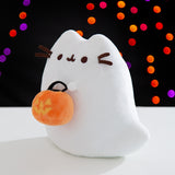 Side quarter view of the ghost plush. The rounded shape of the plush details Pusheen the Cat's classic ears but also has a ghost tail that sits out to her left side.