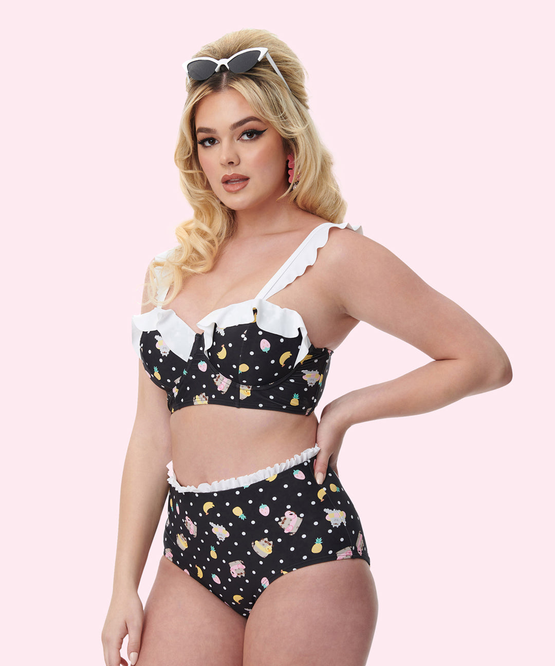 Model is turned to the side while wearing the Pusheen Bikini Set. The top edges of the swimsuit have white ruffle details on the edges.