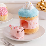 Front view of the Sprinkle Pusheen Cake Plush. The light blue, pink, white plush environment mimics the look of a layered birthday cake with multi-colored sprinkles. The Pusheen the Cat plush sits outside the plush cake environment.