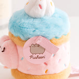 Close-up view of the Pusheen Label logo hangtags. The light pink tags feature the Pusheen the Cat logo on the circle sticker while Pusheen’s face is embossed in the rectangular shaped tag.  