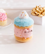 Alternate side quarter view of the Pusheen Sweets Sprinkle Cake Plush Environment. The blue, pink, and brown plush has a removable miniature plush of Pusheen the Cat.  