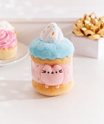 Front view of the Pusheen the Cat Sprinkle Cake Plush environment. The light pink plush color matches the middle layer of the cake decorated with sprinkles. 