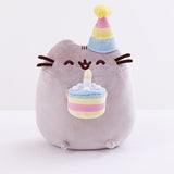 Front view of the Birthday Pusheen Plush in front of a white background.