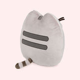 Back view of the plush shows Pusheen’s classic grey head and back stripes and striped grey tail.