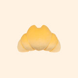 Back view of the croissant-inspired squisheen plush. The main body is accompanied by two smaller sections of plush on either side giving the jumbo-sized squisheen a triangle shape.
