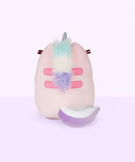 Quarter view of the Dreamy Pusheenicorn Squisheen facing the left in front of a light purple background. The white cloud on the front is more visible from this angle, though the multicolor mane is only visible directly behind Dreamy Pusheenicorn’s horn.