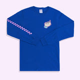 A bright blue graphic long sleeve tee against a pink background. The t-shirt has two graphics on it: one of Pusheen in the top right of the front of the tee and a pink grid print down the left-facing sleeve. 