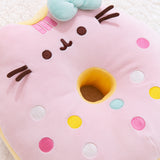 Close-up view of the Pusheen side of the pink and white donut plush. This photo showcases the pastel embroidered sprinkles and Pusheen’s stripes.  