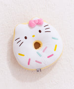 Full front view of Hello Kitty side of reversible Donut Plush. Donut plush lays on light white carpet surface.  
