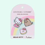 3 patches on a cardboard backing in front of a light blue background. The pink cardboard backing has a rounded top, a rainbow, and the Hello Kitty x Pusheen logo.