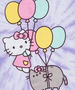 Close-up view of the large graphic on the front of the purple tee. Pusheen is shown with a Hello Kitty pink bow on her head with balloons tied around her waist to make her float. Hello Kitty is shown to her left giving a thumbs up an holding balloons to allow her to float with Pusheen. 