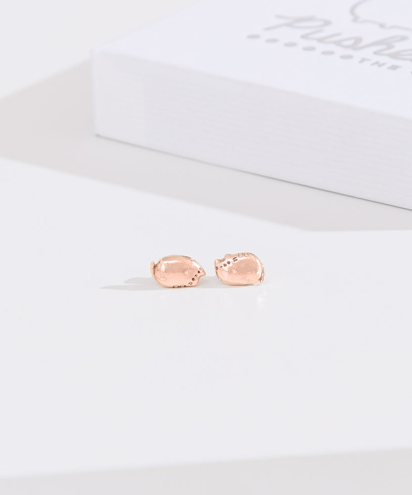 Front view of rose gold vermeil finish of Lazy Stud Earrings. The earrings are an unmatched pair of Pusheen sitting in two different loaf poses. 