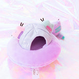 Back overhead view of the Mini Lilac Pusheen takes the first steps onto the holographic ground while the Mint and Pink Pusheen look on from the safety of their plush ship. The Mini Pastel plush all have two back stripes, along with a striped tail. At the back of the UFO there is a information tag attached to the bottom of the plush.
