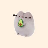 Left quarter view of avocado plush. This view shows Pusheen’s feet extending slightly off her body and the dimensions of the cut-in-half avocado.