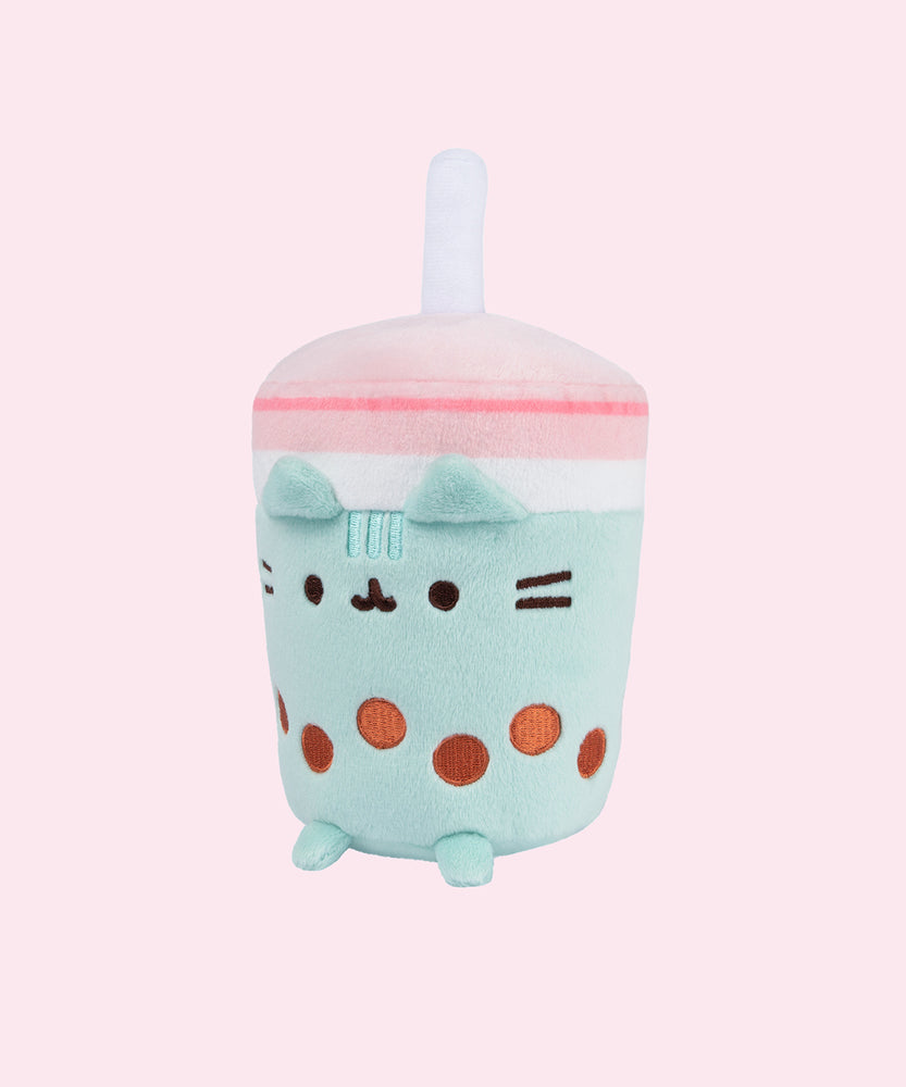 Front view of the Boba Tea Sips Plush with a slight side profile. Plush is accentuated by a light pink background. 