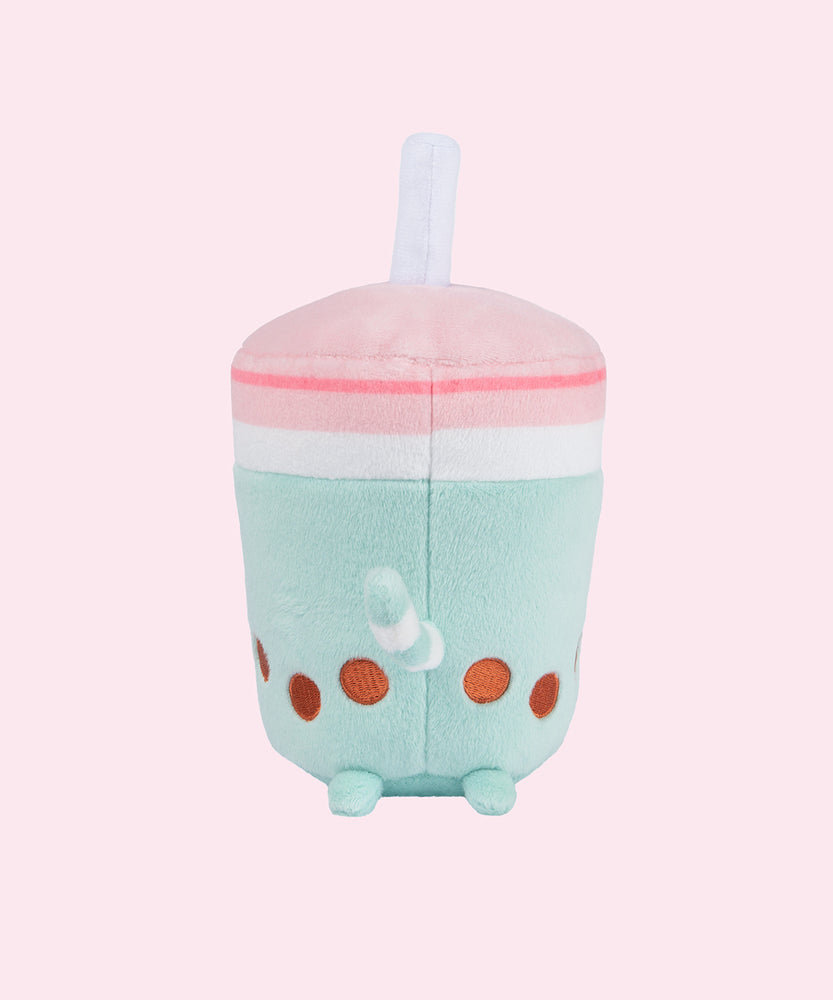 Back view of the Boba Tea Sips Plush. The back of the plush has an extended white and mint striped tail above its plush back feet and brown boba embroidery detail.  