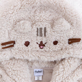 Close up of Pusheen's face on the hood. Pusheen's face and forehead stripes are embroidered into the hood and the whiskers are strips of brown felt. Pusheen's ears are made of the same fuzzy fabric as the rest of the hoodie. The interior of the hoodie is a light mech.