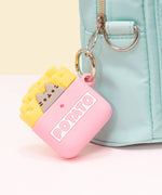 Pusheen French Fries Airpods Case clipped to a mint green backpack. The pink case features Pusheen the Cat in her classic form as a grey cat with black eyes, whiskers, and nose. The cat sits in a pink fry container with the word Potato highlighted in white with yellow french fries coming out of the container. 