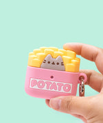 Hand holding Pusheen French Fries Airpods Case for Airpods 3. Pink case features Pusheen, french fries, and a metal carabiner.