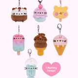 Front view gif of Pusheen Ice Cream Surprise Plush assortment. Pusheen the Cat has taken the form of seven miniature plush in ice cream varieties. The bottom right corner has a heart with the words “1 Mystery Design!” indicating eight possible miniature plush keychains are available. 
