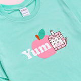 A close-up view of the tee's screen print graphic. Pusheen is shown as a Juice Box with an apple accompanying the character.  