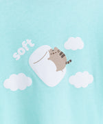 Close-up view of Pusheen graphic that is in the center of the pajama tee. Pusheen is shown surrounded by white, fluffy clouds while she dreams on a white marshmallow.  
