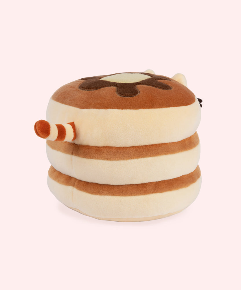 A back view of the Pusheen Pancake Squisheen. The plush has a cream and light brown tail. Pusheen's does not have any paws in this pancake plush form.