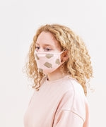 Model wearing the Pusheen Patterned Face Mask. The mask covers the nose and the bottom of the chin.