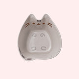 Top view of Ramen Bowl that shows the full interior of the bowl.  Pusheen's eyes, nose, and whiskers are a brown color while her forehead stripes, paws, and tails are a mix of light grey and dark grey colors.