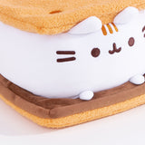 Close-up view of Pusheen S'mores Squisheen.This view shows Pusheen’s white marshmallow feet extending off her body resting atop the chocolate slab.