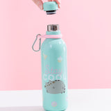 The Pusheen Stainless Steel Waterbottle with it’s cap removed, being held above the bottle by a model’s hand, in front of a white and pink background. The cap has a black stopper with a grey rubber seal, and the rim of the bottle is steel.