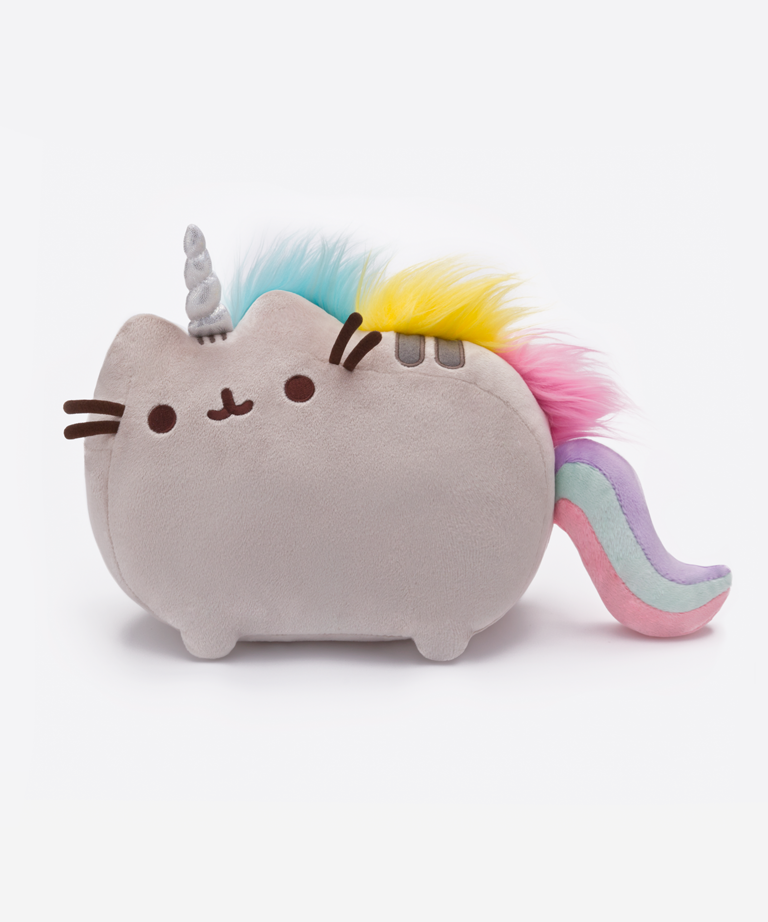 Front view of the Pusheenicon plush in a white space. In this lighting, the unicorn horn appears silver instead of white. Pusheen’s three head stripes are still visible underneath the unicorn horn, and the two back stripes are visible underneath the technicolor mane.