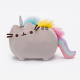 Front view of the Pusheenicon plush in a white space. In this lighting, the unicorn horn appears silver instead of white. Pusheen’s three head stripes are still visible underneath the unicorn horn, and the two back stripes are visible underneath the technicolor mane.