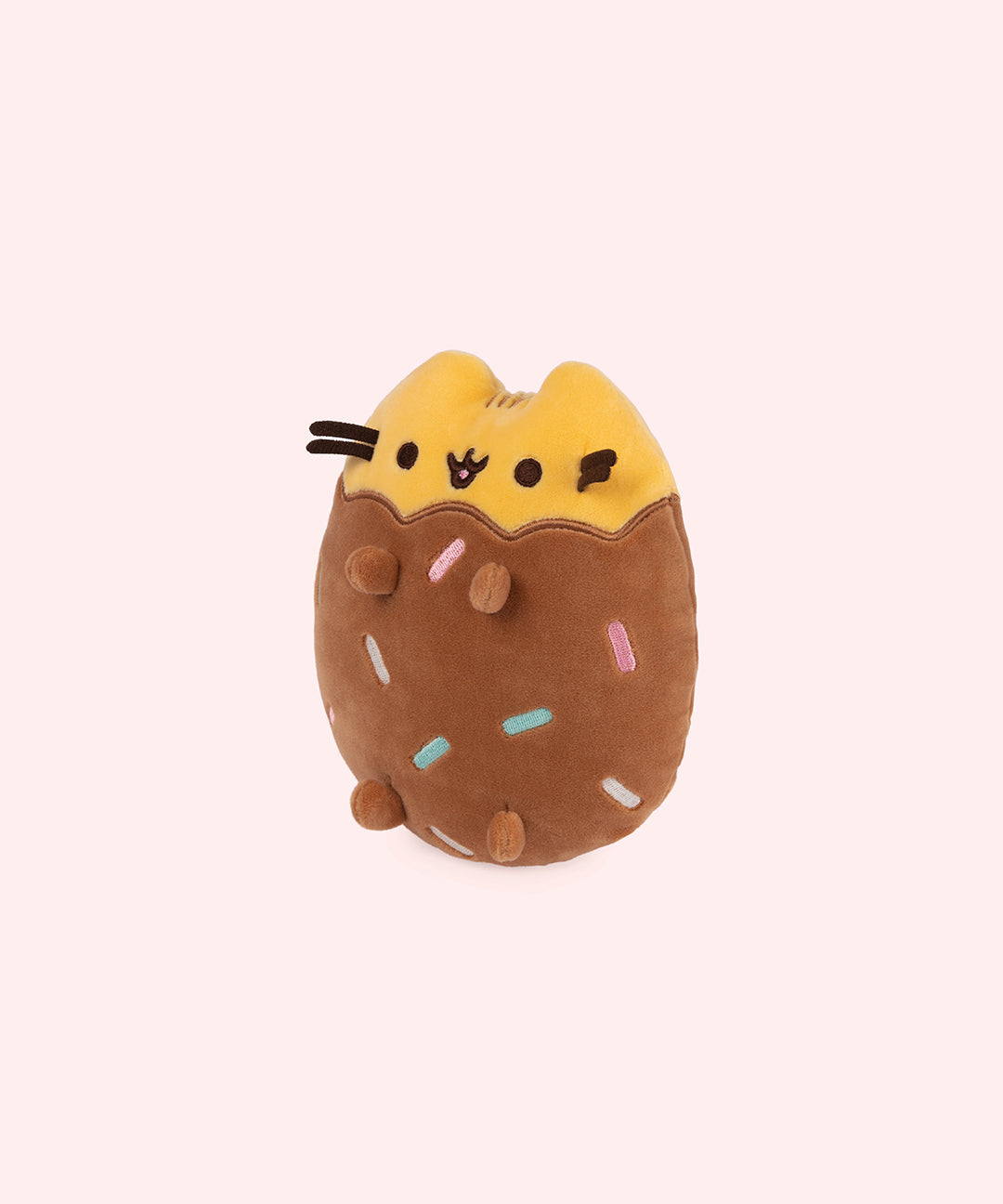 Left quarter view of cookie inspired plush. This view shows Pusheen’s feet extending slightly off her body. 