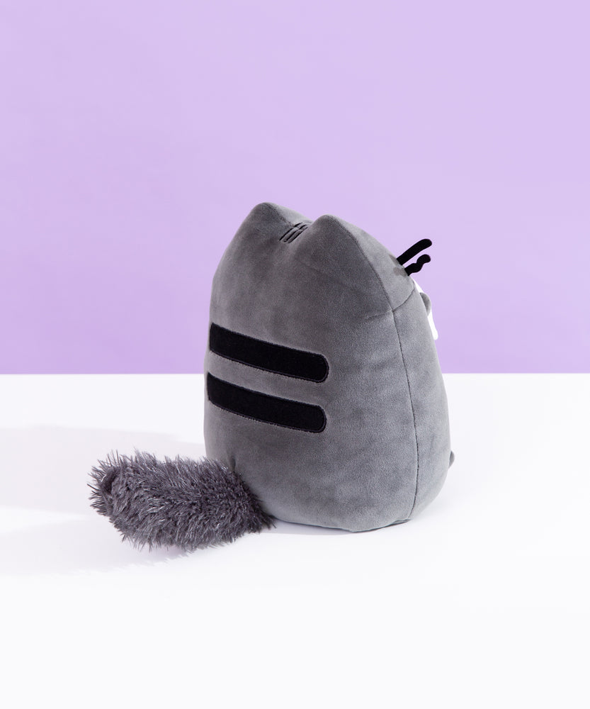 Back quarter view of Pusheen Scaredy Cat Squisheen. This view shows Pusheen’s back stripes and her classic tail has turned scaredy and is shown all fluffed out. 