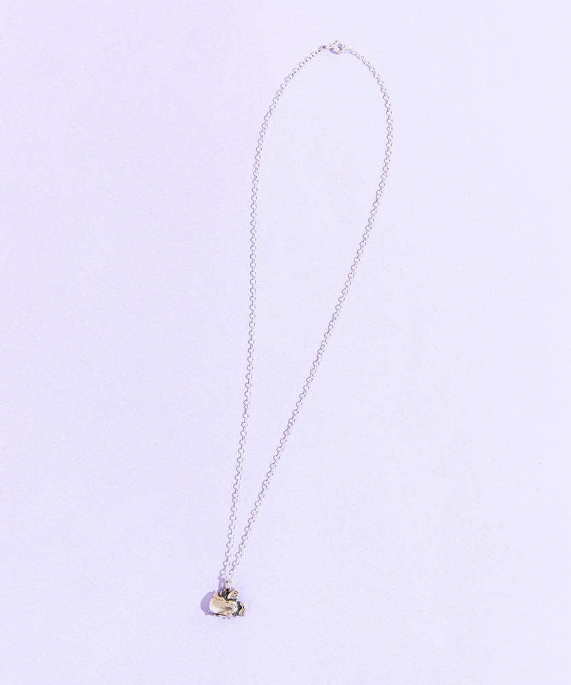 Full view of the Silver Super Pusheenicorn Charm Necklace on top of a light purple background. The necklace chain uses a spring ring.