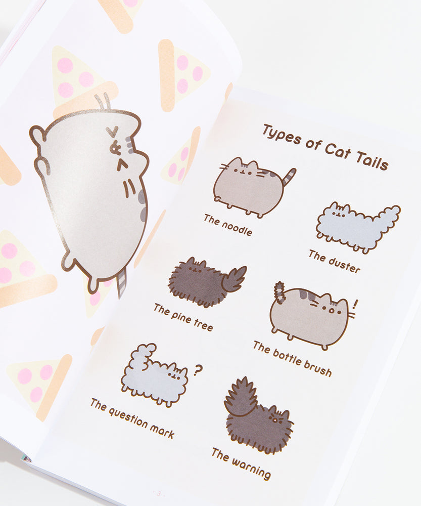 The interior of the book, showing off the ‘Types of Cat tails’ comic with Pusheen, Stormy and Pip. On the left page is an illustration of Pusheen leaping in front of a pattern of pizza slices.