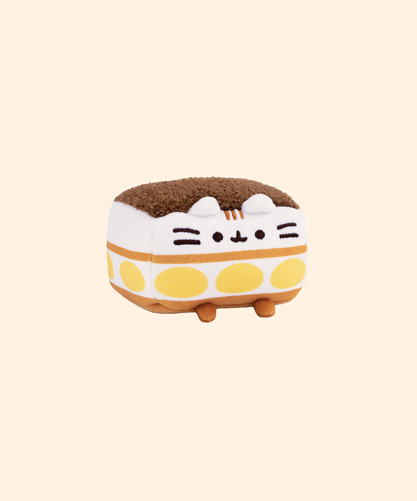 Right quarter view of the Tiramisu Squisheen shows Pusheen the Cat’s classic facial features including black eyes, mouth, and whiskers. 