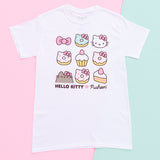 White short sleeve graphic tee featuring Hello Kitty and Pusheen. The graphic is a 3x3 square grid of objects laid aside one another, with the Hello Kitty x Pusheen collaboration logo underneath. The top row has Hello Kitty's bow, a mint donut, and Hello Kitty's head. The middle row has 2 white donuts and a cupcake with a strawberry. The bottom row has Pusheen's head wearing a Hello Kitty bow, a pink donut, and a cake slice with a strawberry on top.