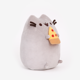 Quarter view of the Pizza Pusheen Plush facing the right in front of a white background. The pizza slice I a yellow plush triangle with a light brown crust and three red dots of pepperoni. The pizza slice is pointing up towards Pusheen’s mouth.