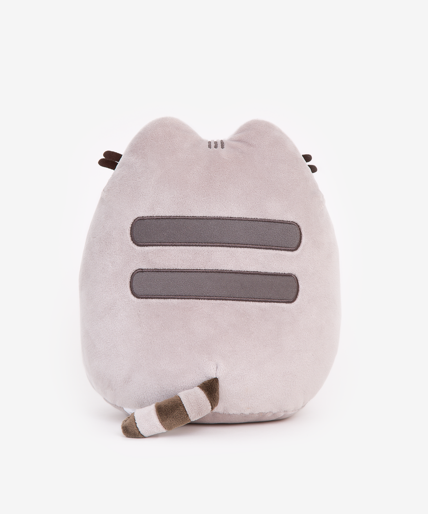 Back view of the Pizza Pusheen Plush in front of a white background. Pusheen’s back has the standard two back stripes and a striped tail. Pusheen’s whiskers stick out partially from the other side.